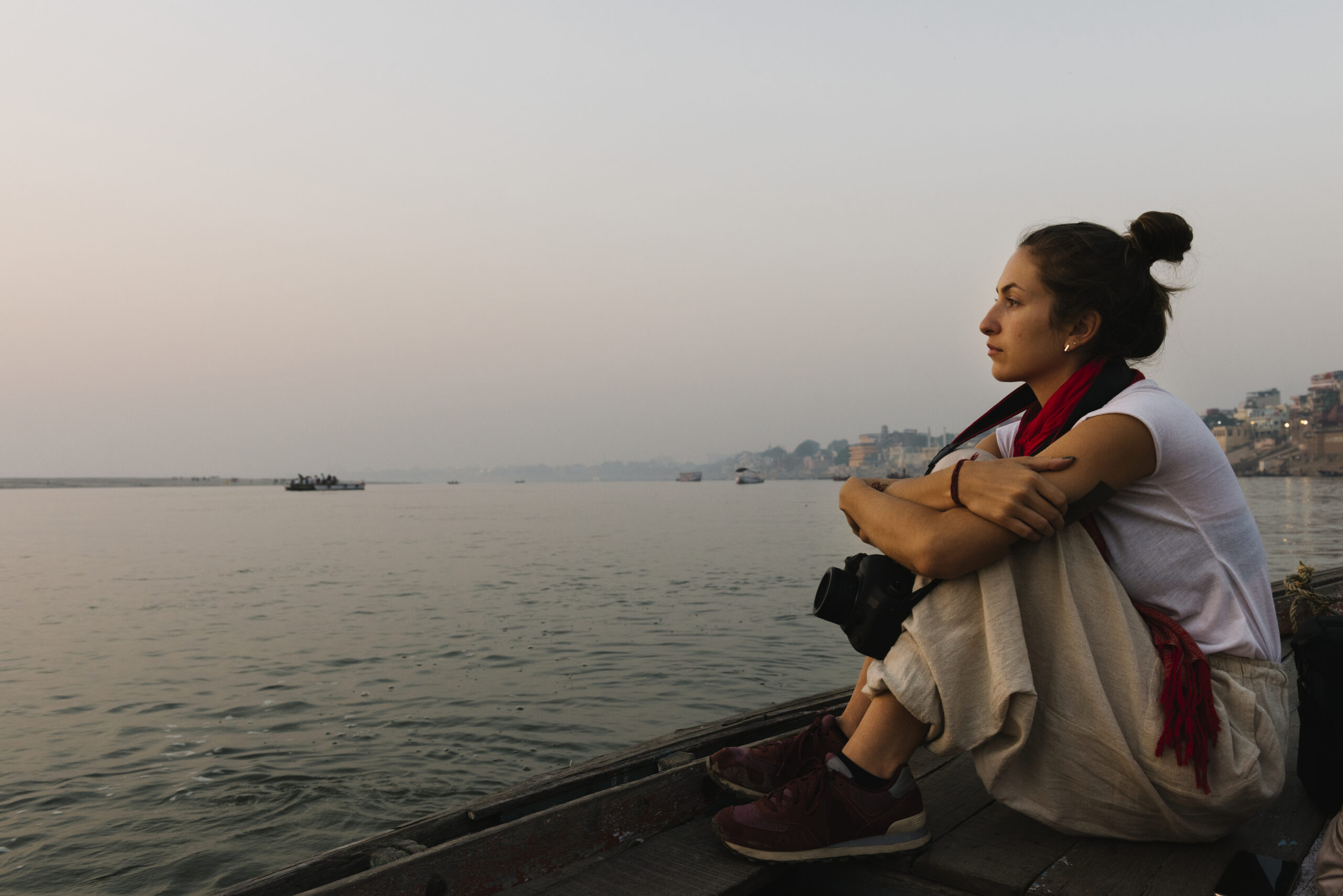 Photographer sitting on a boat on the River Ganges